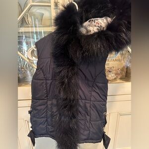 Super stylish and chic girls navy vest w/ faux fur trim and ribbon accent.